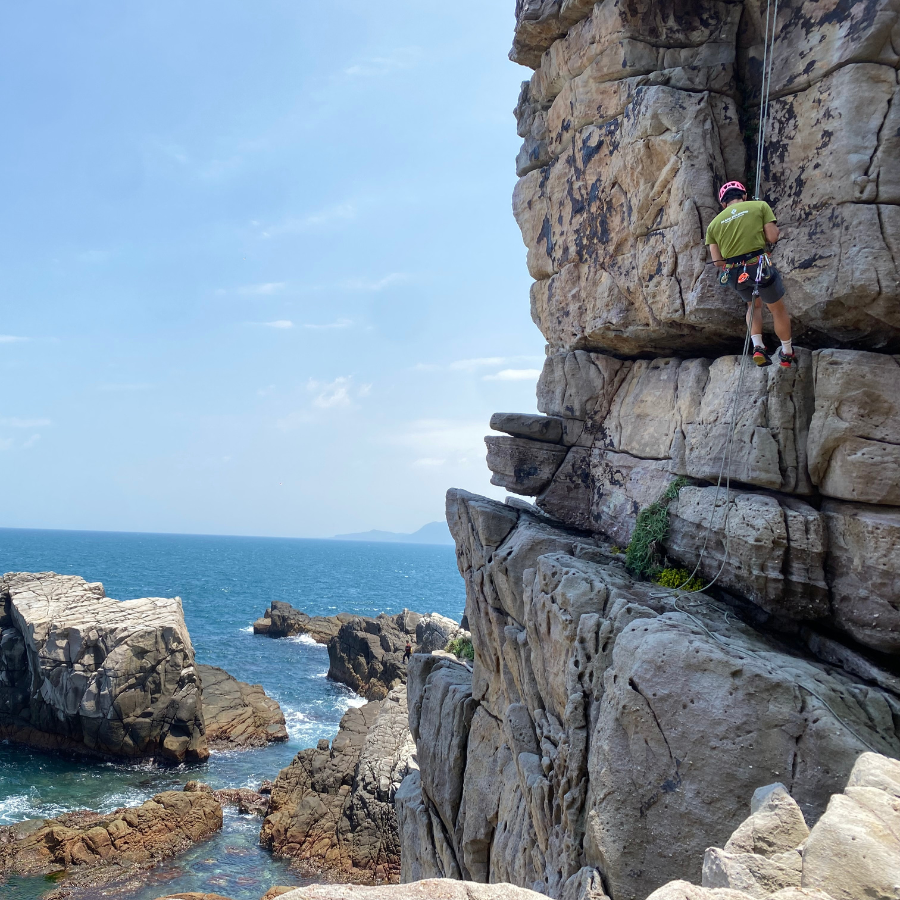 Climber exploring Longdong cliffs