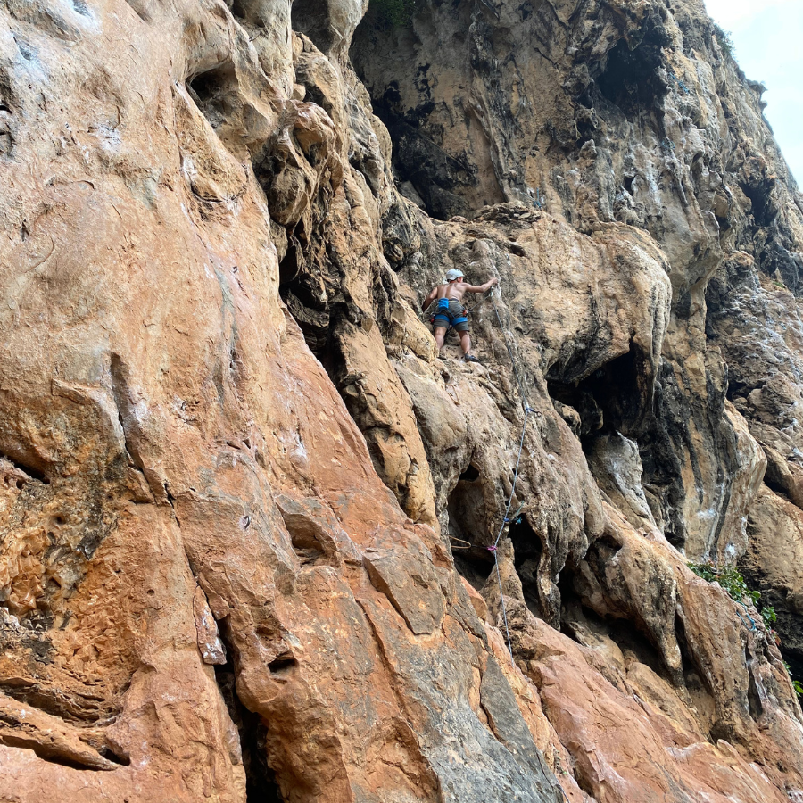 Byrdie climbing the North Wall at Thaiwand Wall, Krabi, with many footholds