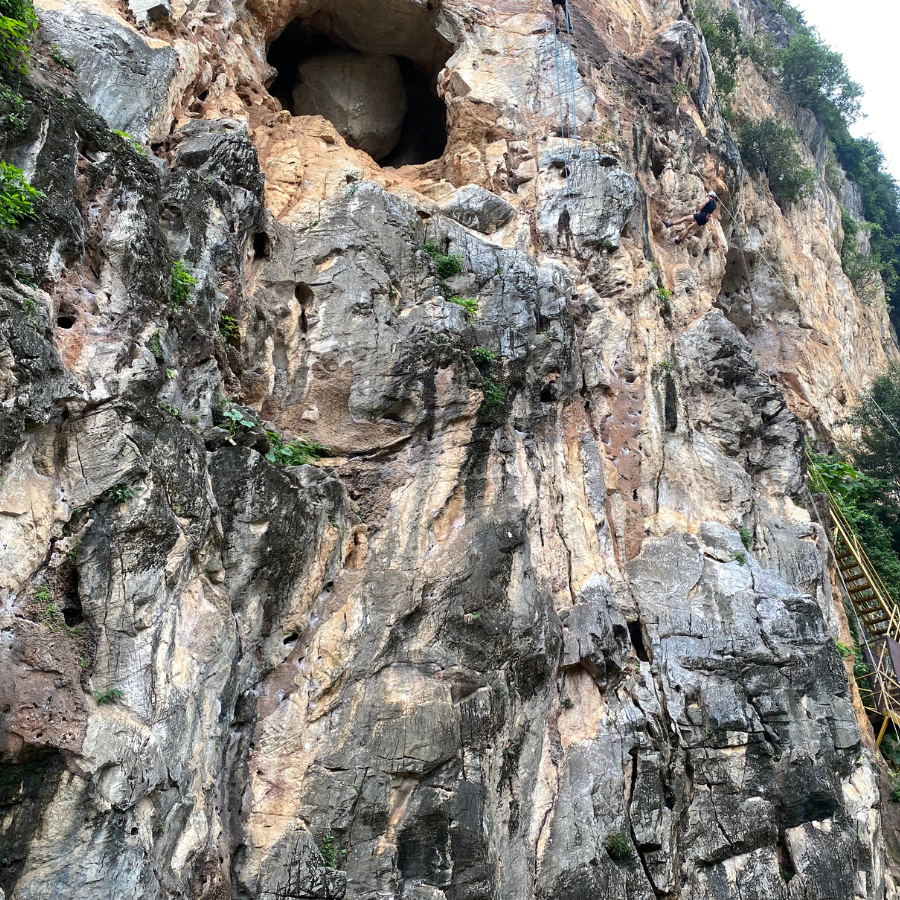 Giant round rock inside cave at Gua Damai climbing area