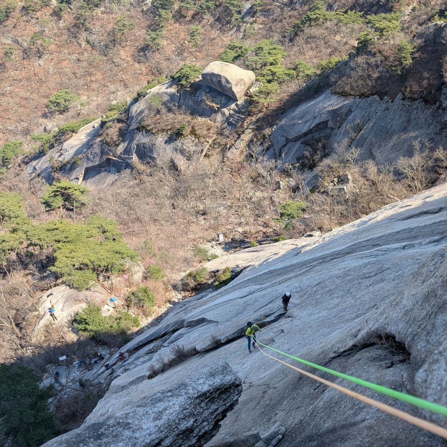climbers resting and talking with mountain views