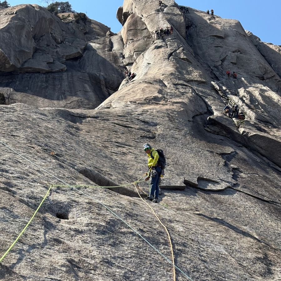 QX leading a trad climbing route at Insubong