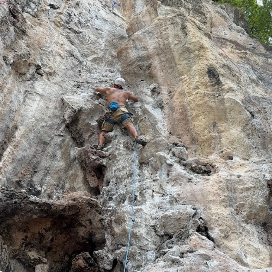 ByrdieOnTheRocks attempting the famous King Cobra hold on Railay Beach climbing route