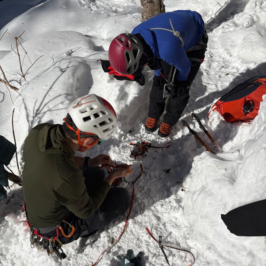 putting on crampons before ice climbing in Hokkaido