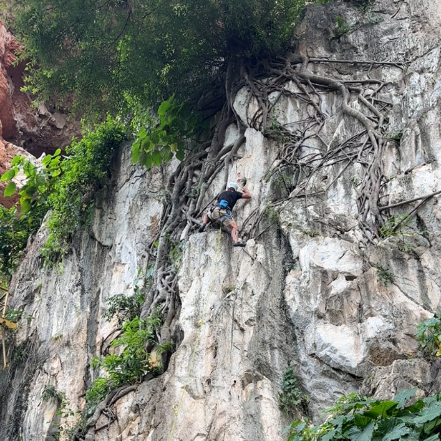 Climber on Pokok route at Gua Damai