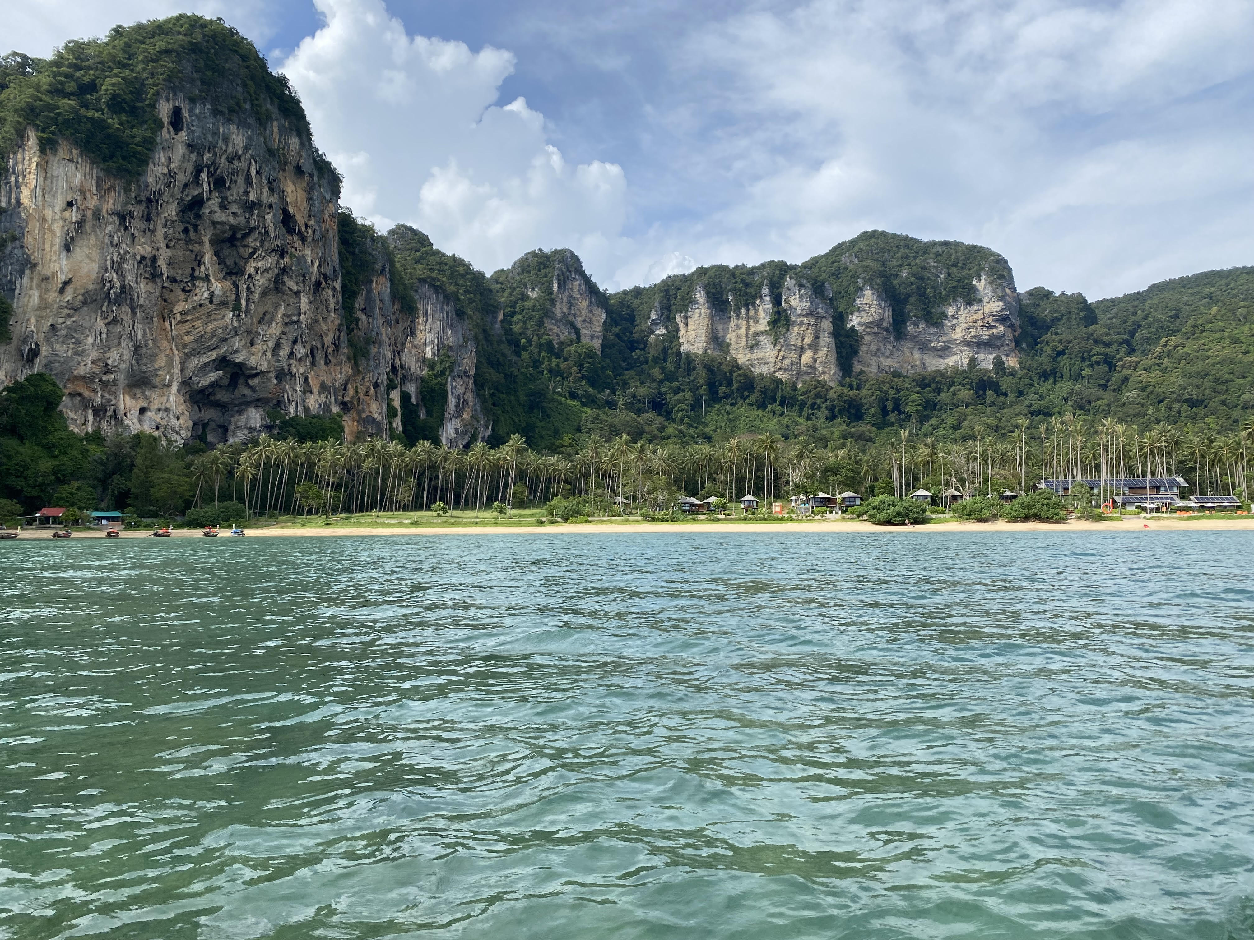 View from the boat towards Railay Beach, showcasing the stunning ocean and landscape of Krabi