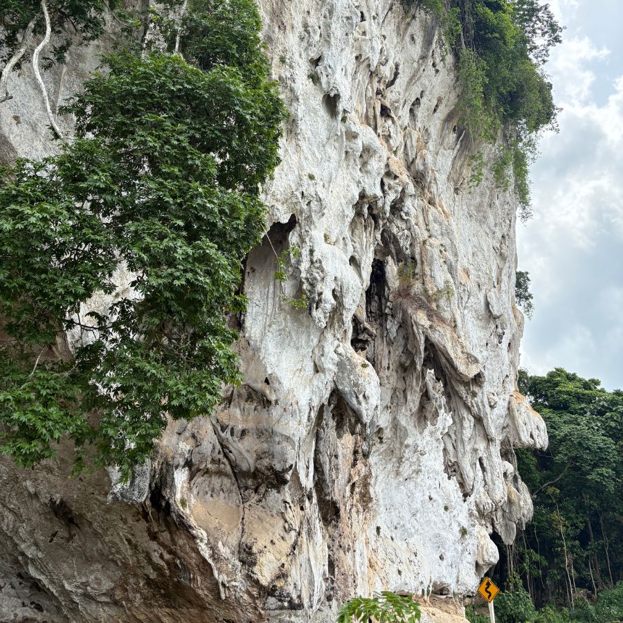 Limestone rock formations at Khao Cha Ang climbing area in Rayong Thailand