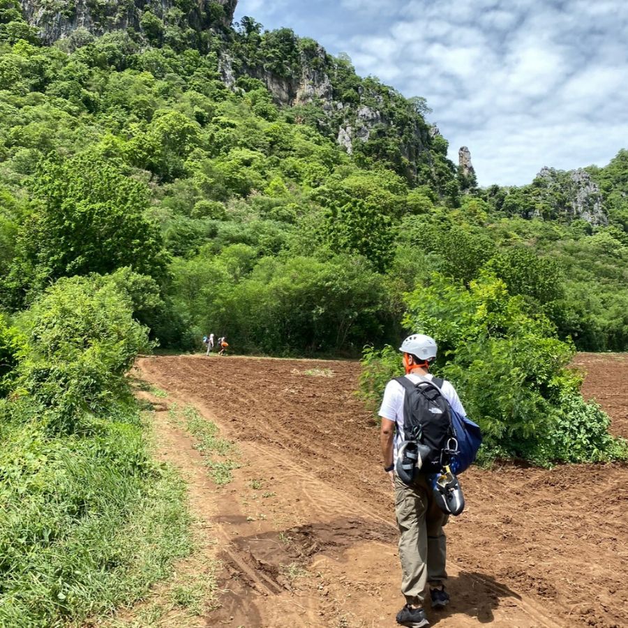 Walking through farmland to reach the Secret Garden climbing area